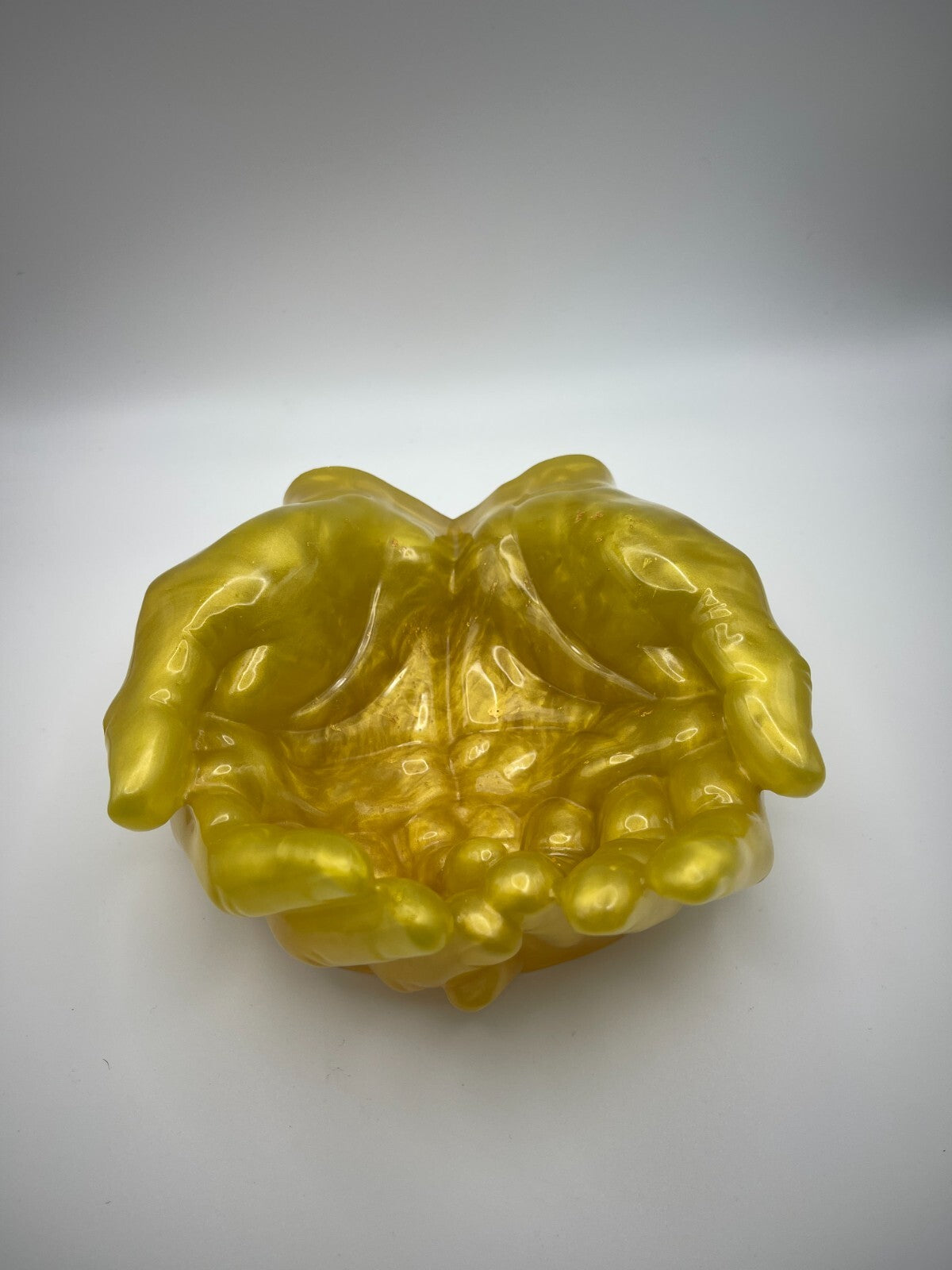 Clasped hands, resin