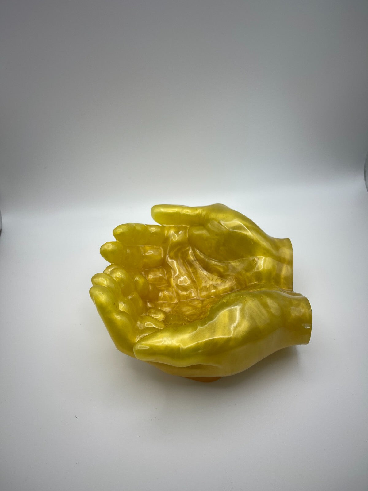 Clasped hands, resin